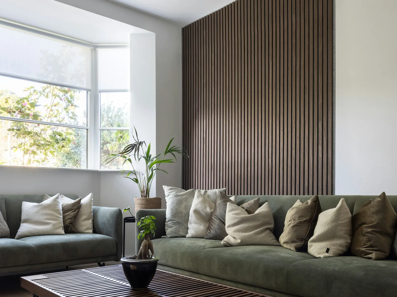 Living room with a dark wood slat feature wall